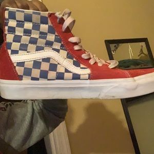Red , blue and white checkerboard vans .